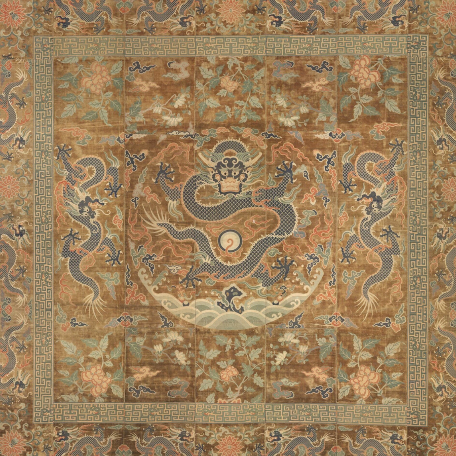 Antique Chinese textile with a central dragon medallion, for the Chinese Energetic Medicine textbook series