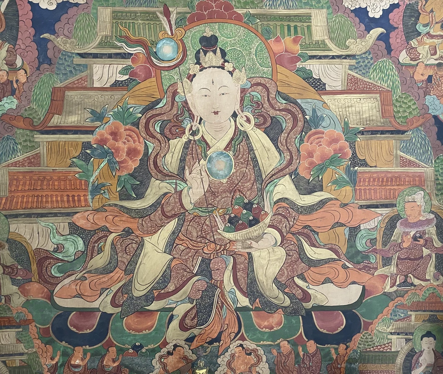 Traditional Chinese temple painting of a seated deity surrounded by ornate patterned detail